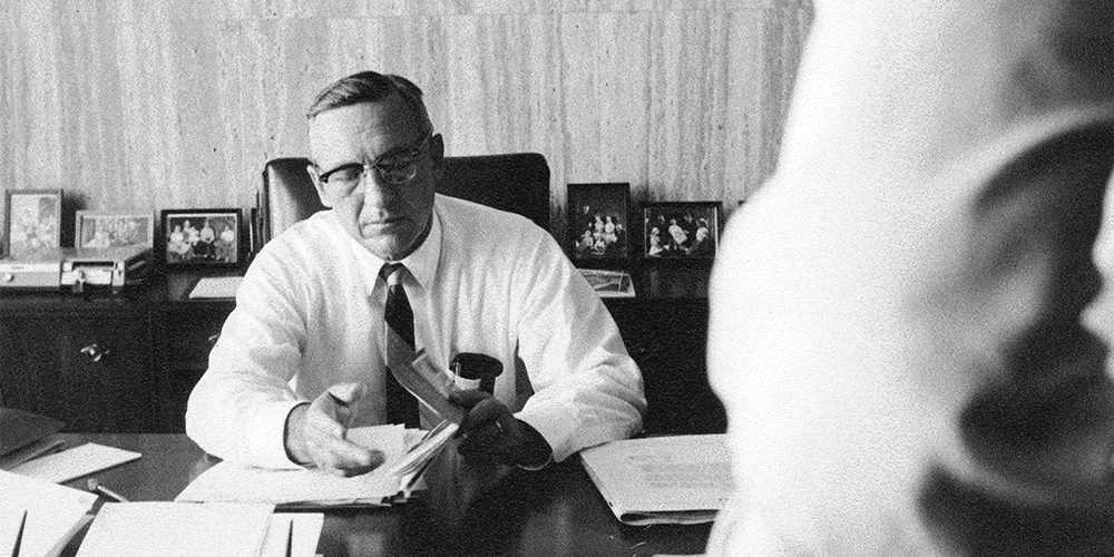 Morris Hite at his desk