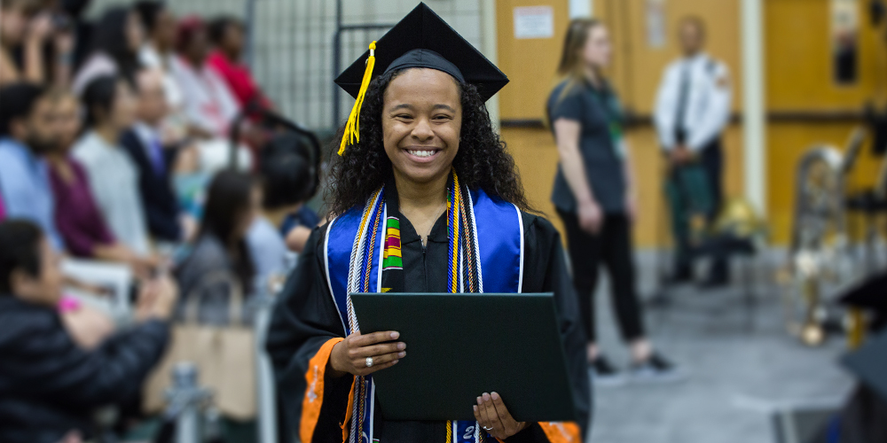 Kyontasia Wilson walks back to her seat after receiving her degree