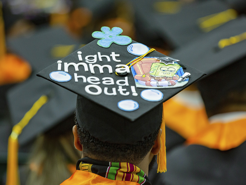 Man wearing a cap on which Spongebob Squarepants is getting up out of a chair and has words that says aight imma head out